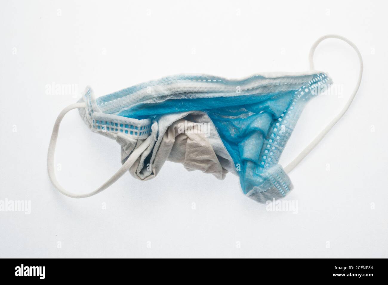 A discarded and used surgical face mask, a increasingly common piece of