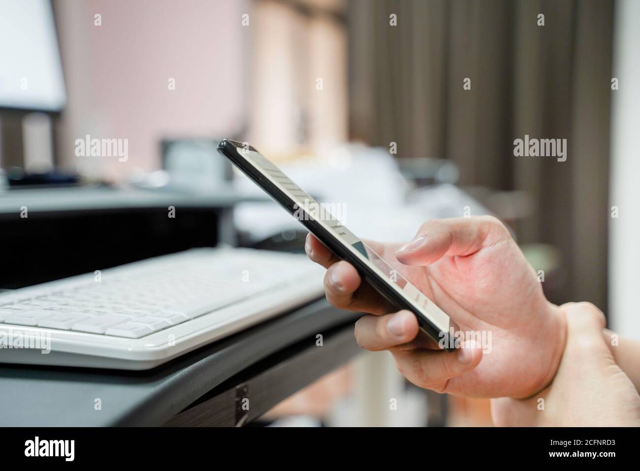 Close up of man's hand holding mobile phone, touchscreen technology