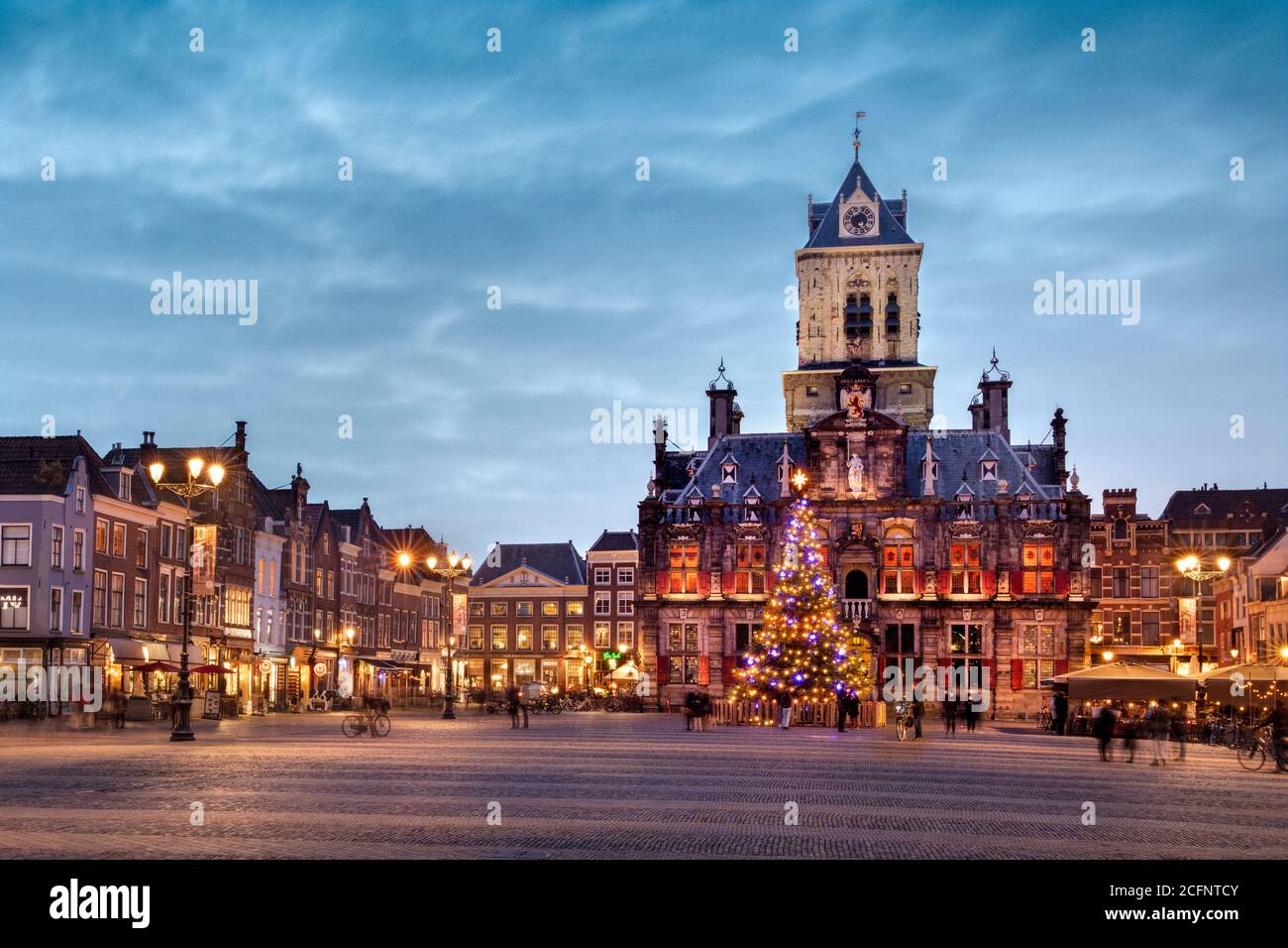 The Netherlands, Delft, Historic centre, old district, Market Square, Markt, city hall, town hall, 1620, Christmas tree, dusk. Stock Photo