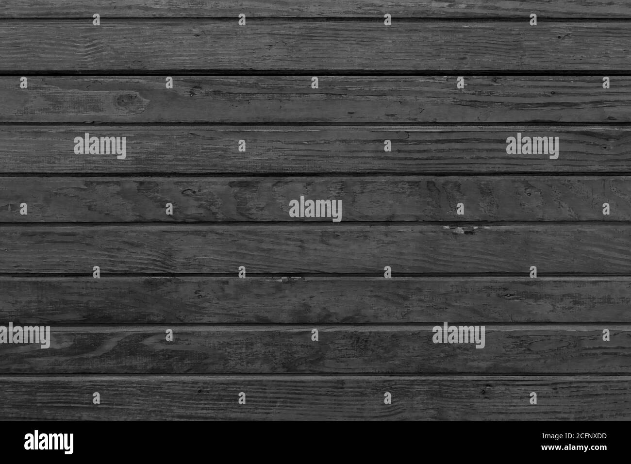 Horizontal black wood background. Old dark wooden background with black wood texture. Dark wood texture panel with horizontal planks. Stock Photo