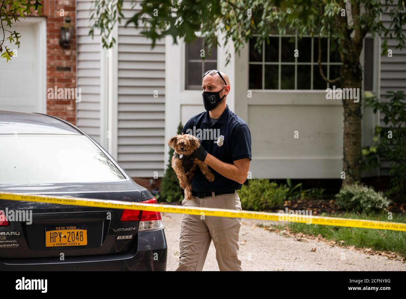 Bloomington, United States. 06th Sep, 2020. A dog is taken to the animal  shelter as police investigate a triple murder-suicide that left four  community members dead at a home in the 2600