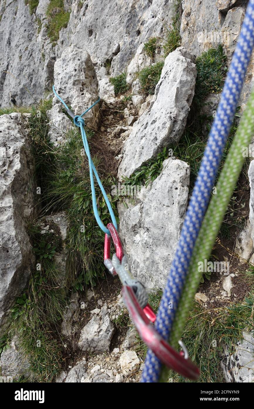 placing mobile rock climbing protection on a natural and obvious knob Stock Photo Alamy