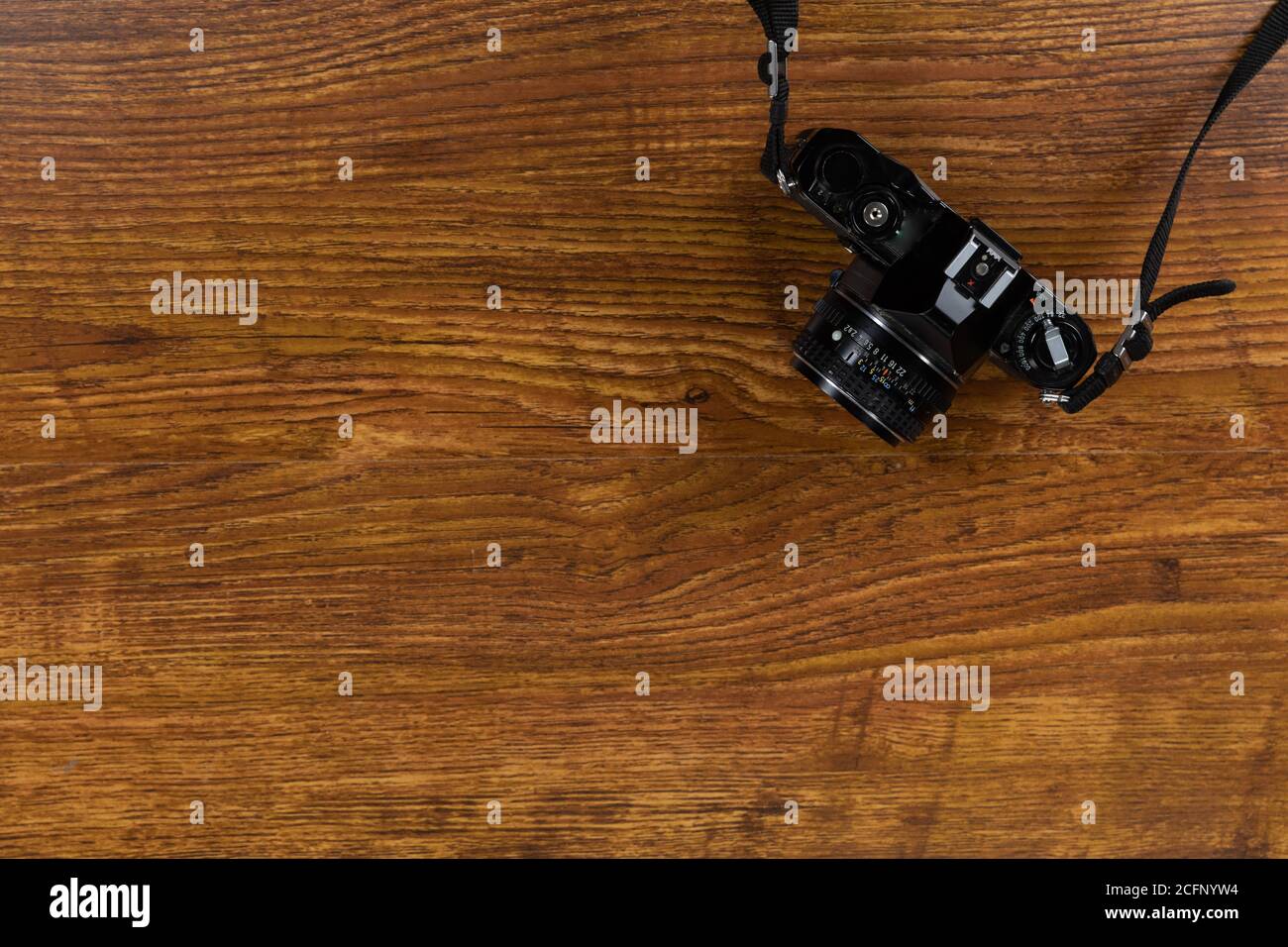 View of a camera on wood table background Stock Photo