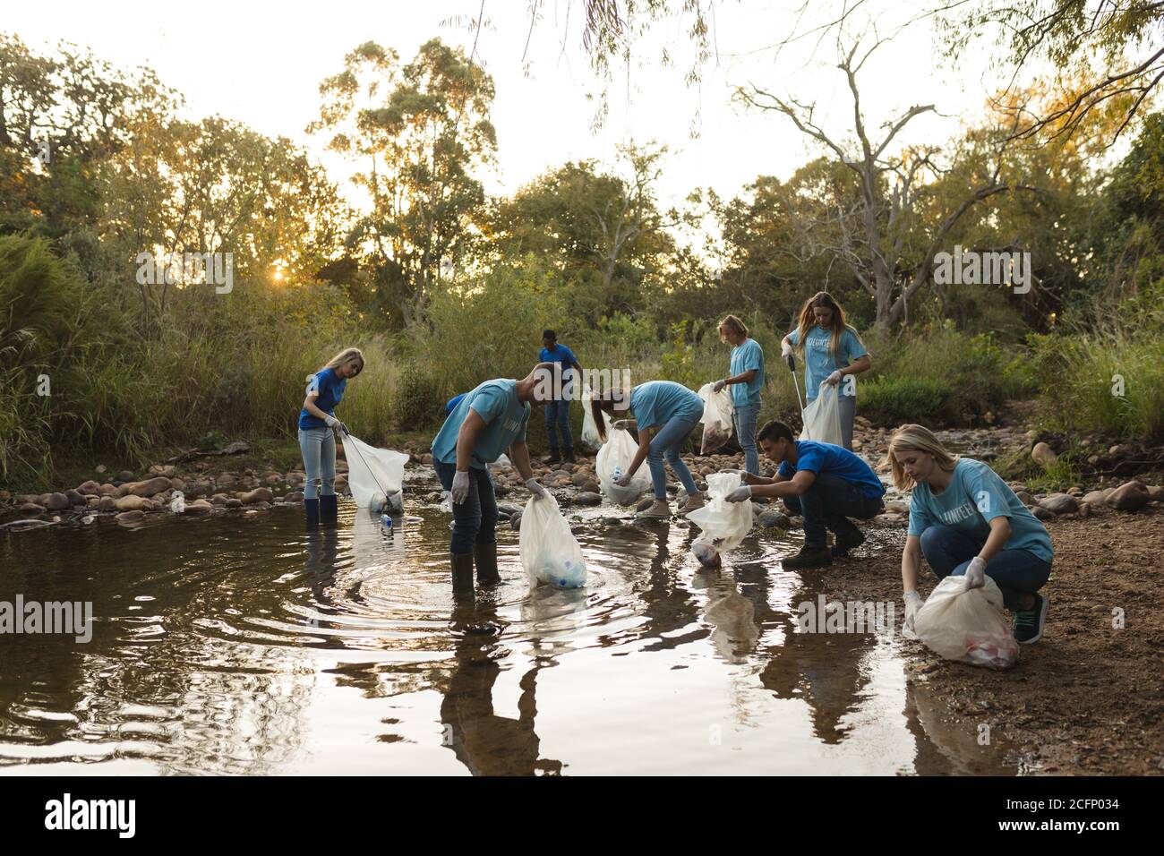 Volunteers cleaning up river Stock Photo