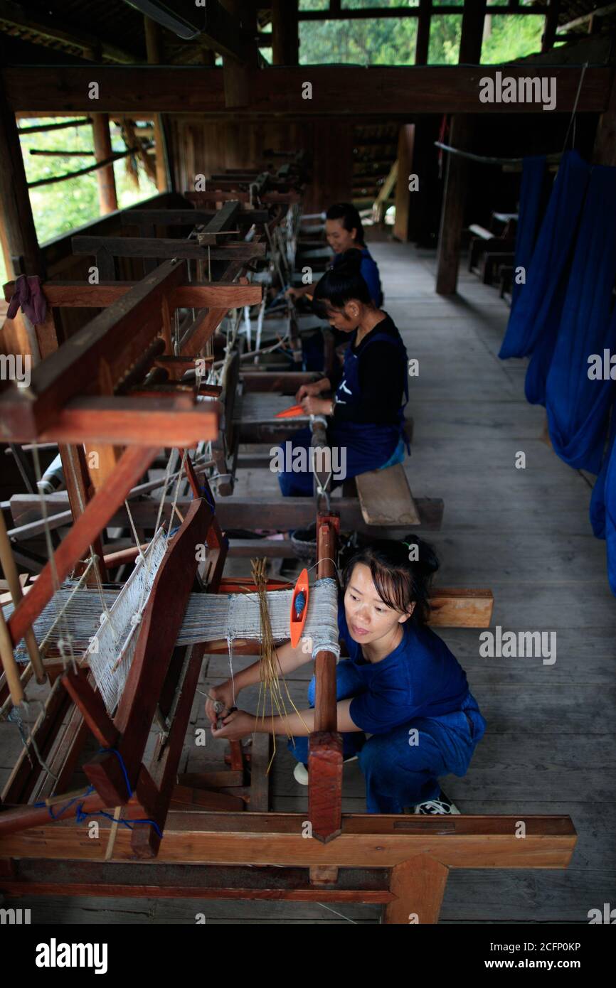 Rongjiang, China's Guizhou Province. 6th Sep, 2020. Women weave cloth at a workshop in Fengdeng Dong Village of Rongjiang County, southwest China's Guizhou Province, Sept. 6, 2020. Locals take advantage of the favorable autumn weather conditions to make the traditional cloth of Dong ethnic group. Credit: Liu Xu/Xinhua/Alamy Live News Stock Photo