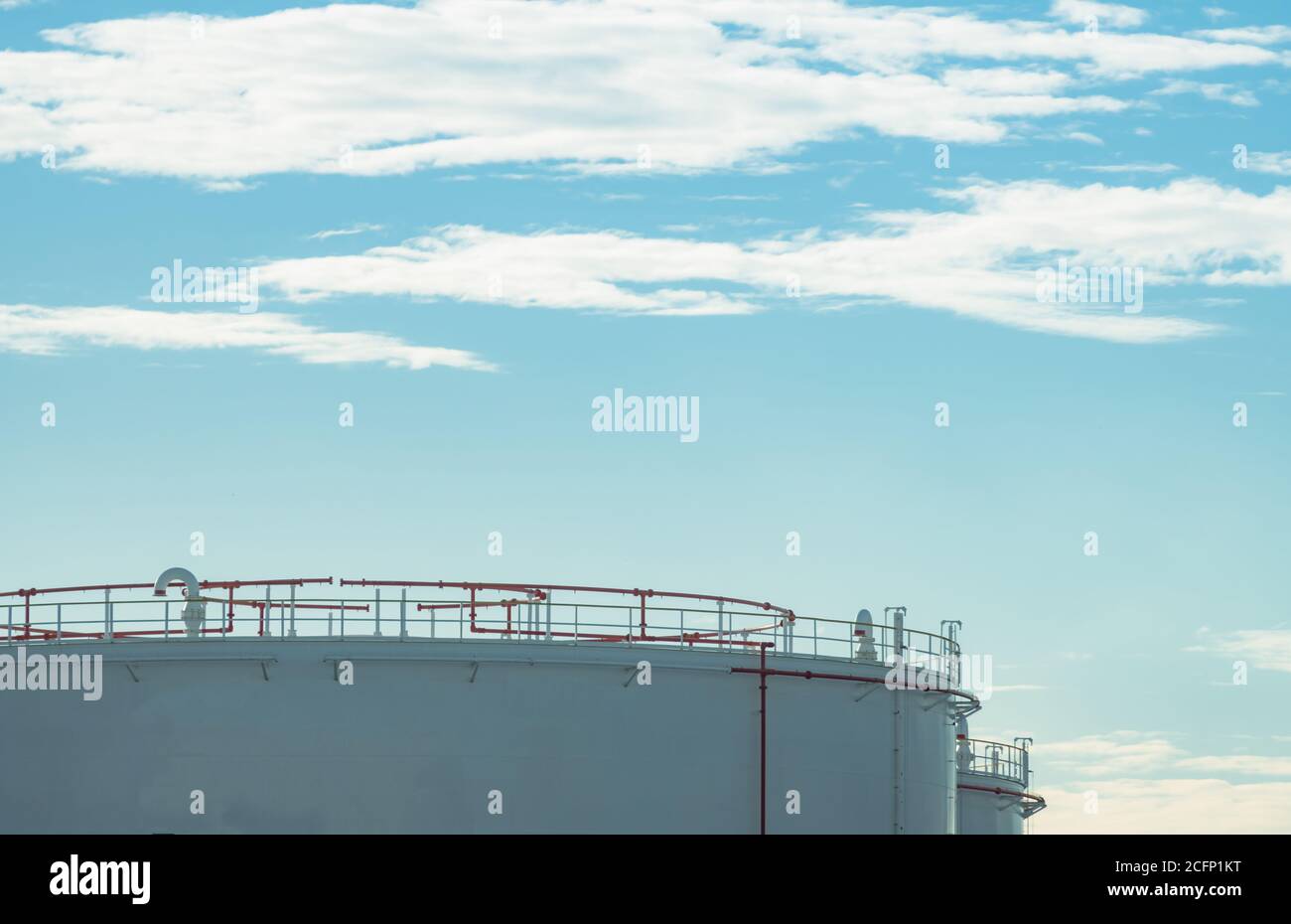 Closeup fuel storage tank in petroleum refinery. White big tank of oil