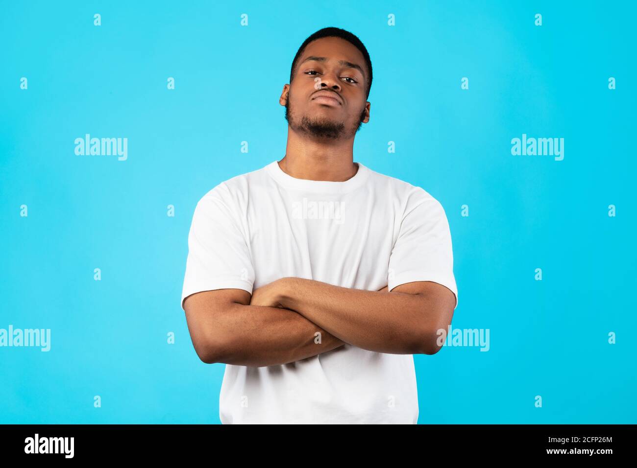 Cool Black Man Standing Crossing Hands Posing On Blue Background Stock ...