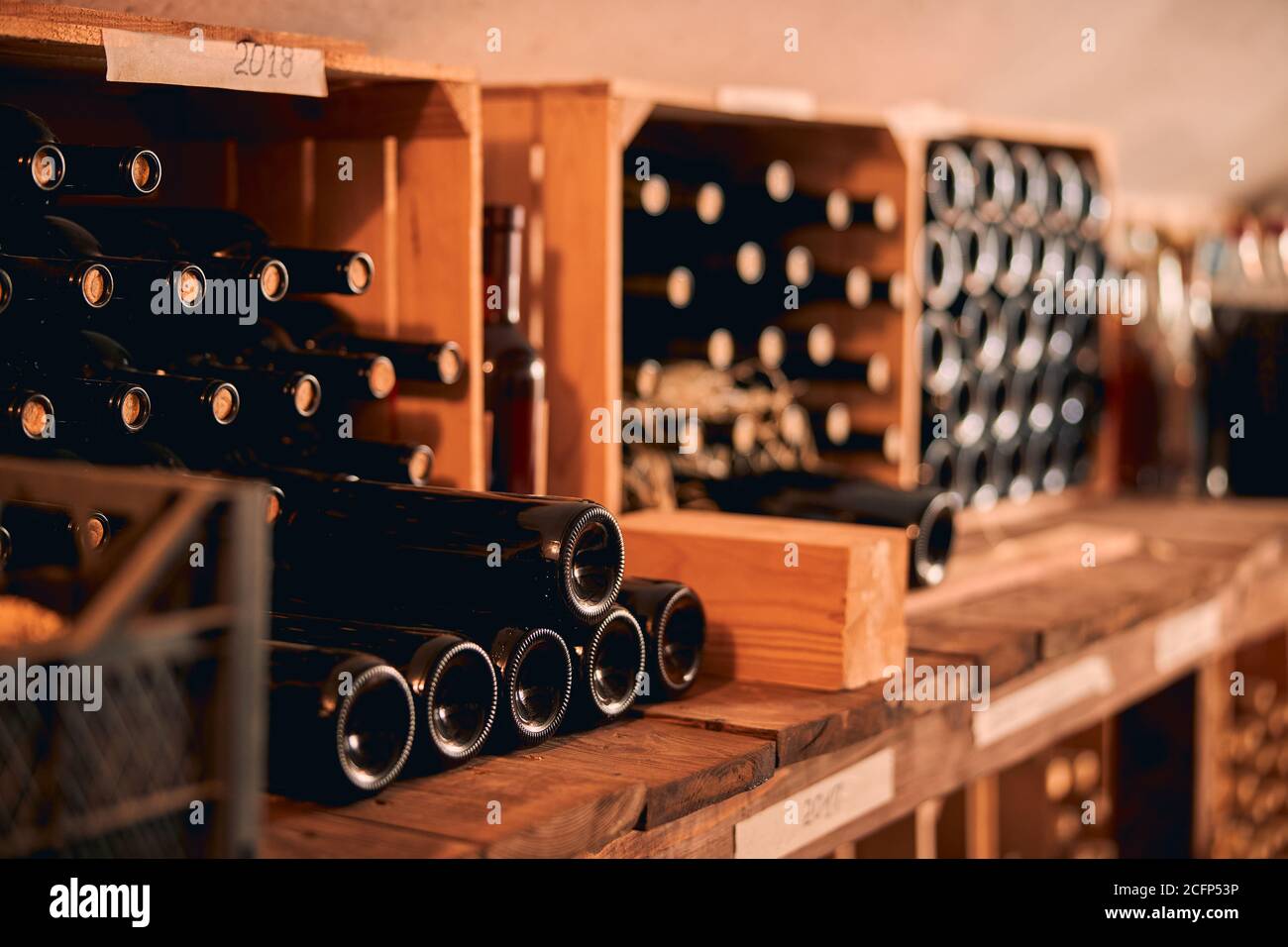 Glass bottles of wine in wooden crates Stock Photo Alamy