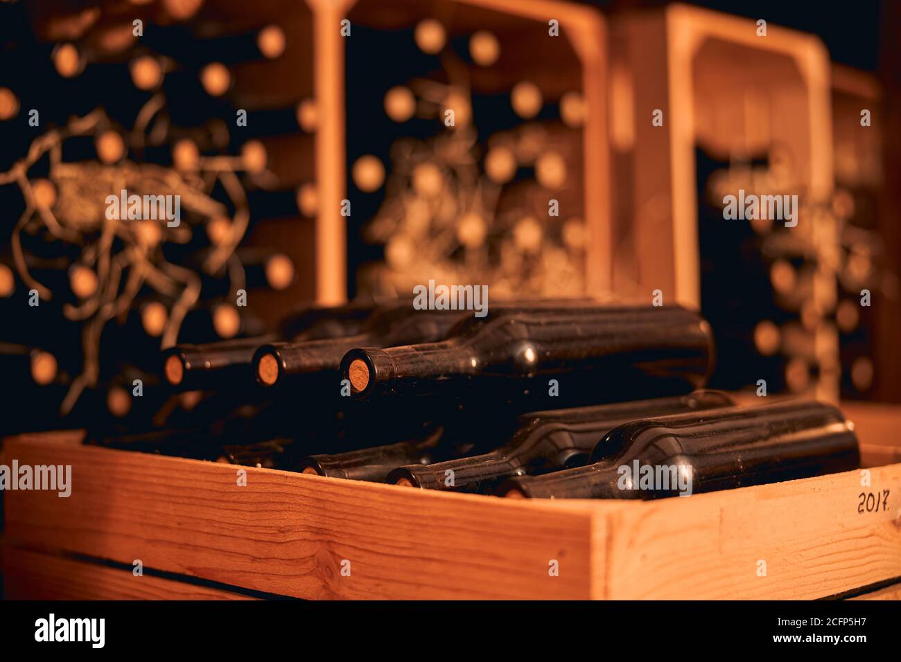 Dusty bottles of red wine in wooden crate Stock Photo Alamy