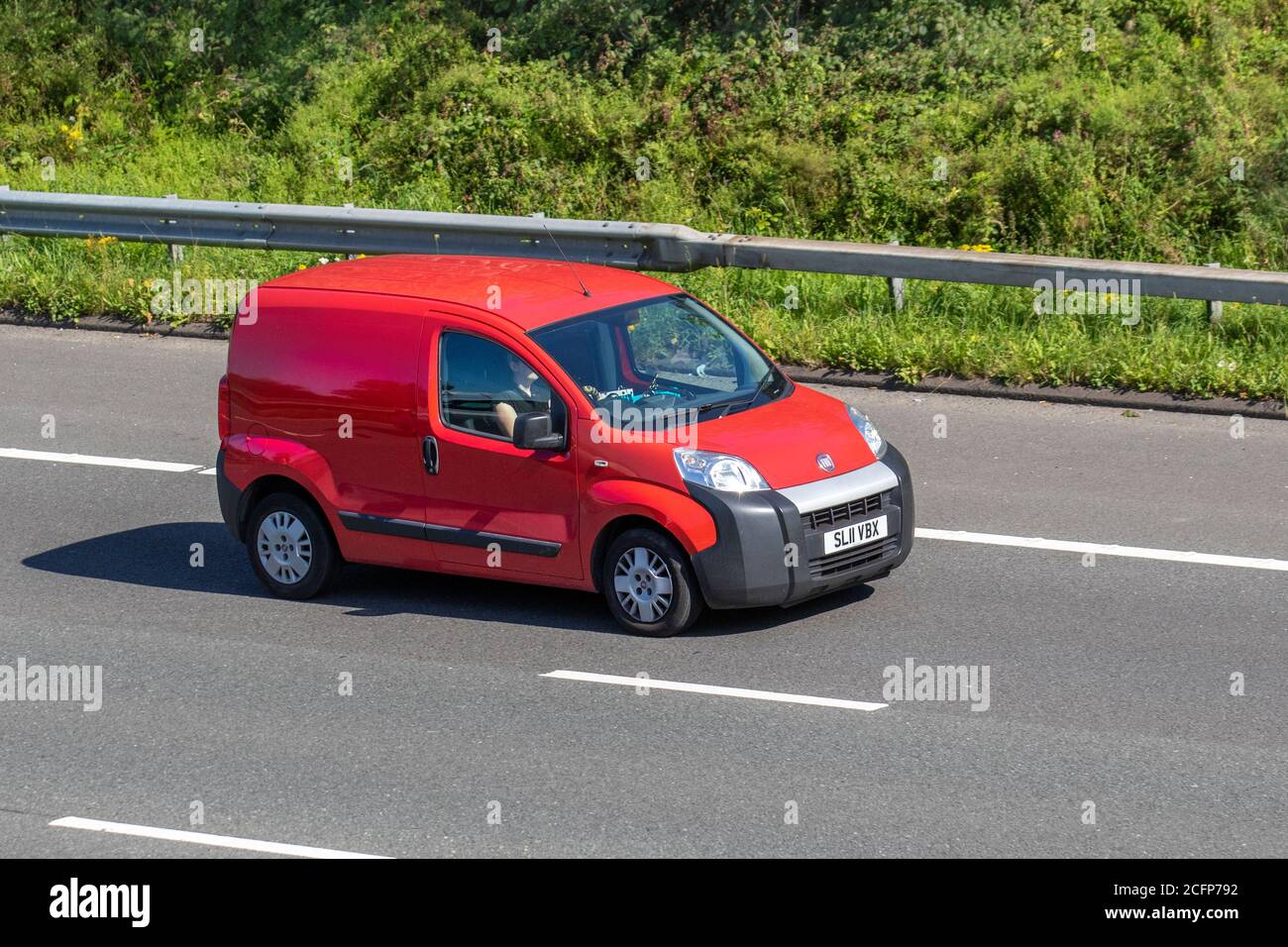 Vehicular traffic moving vehicles, cars driving vehicle on UK roads, motors, motoring on the M6 motorway highway network. Stock Photo
