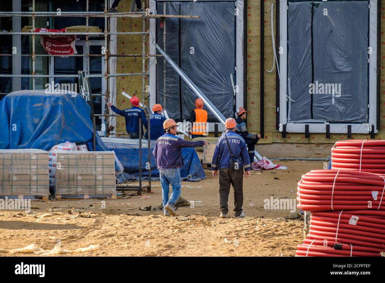 Construction workers in orange uniforms hi-res stock photography and ...