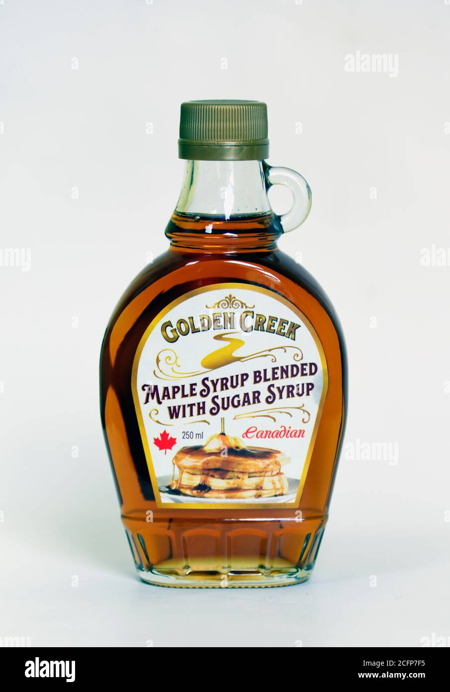 Bottle of 'Golden Creek' Canadian maple syrup blended with sugar syrup. 250ml. Stock Photo