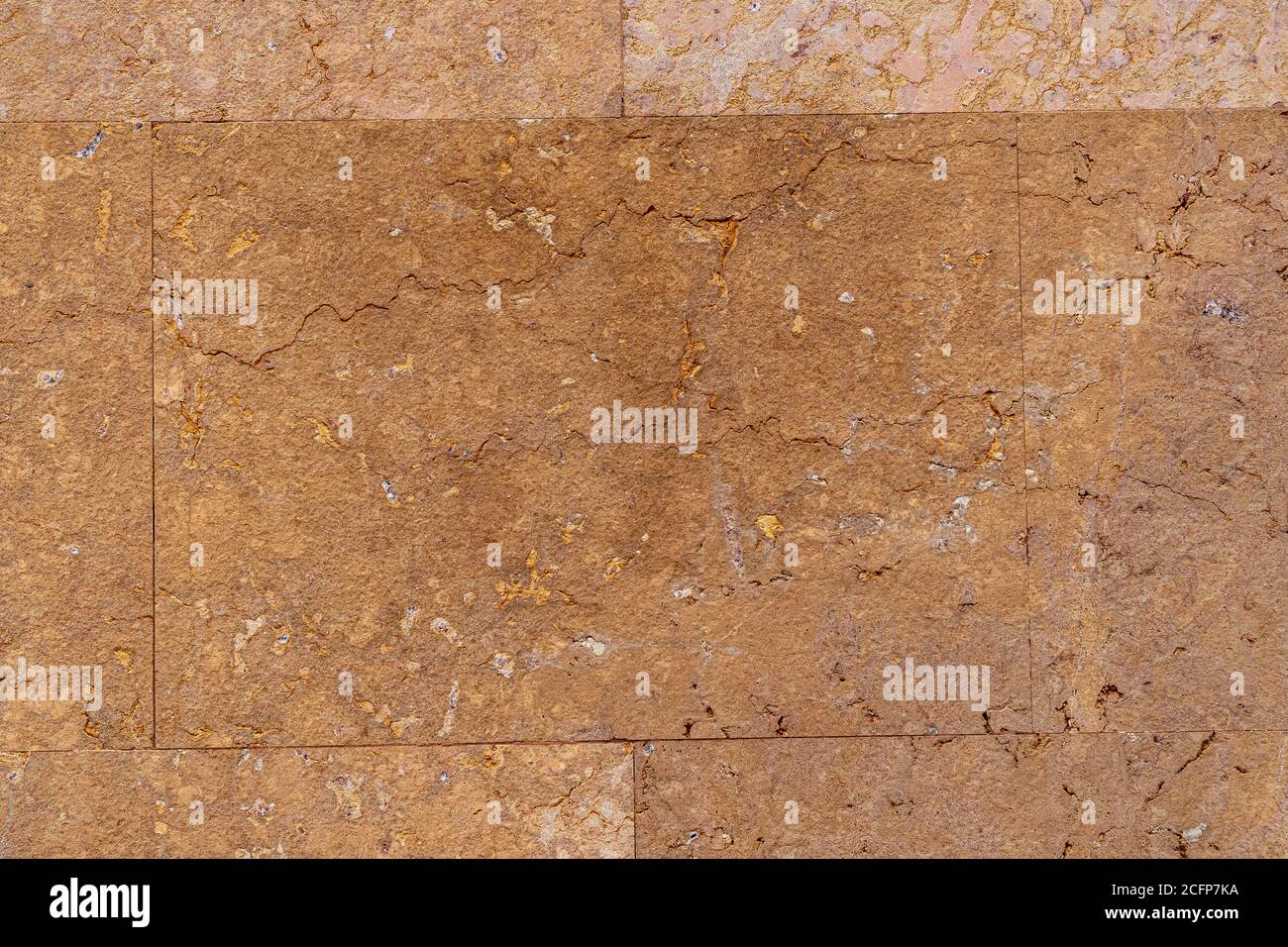 Old weathered brown wall tile with cracks in high resolution close up Stock Photo