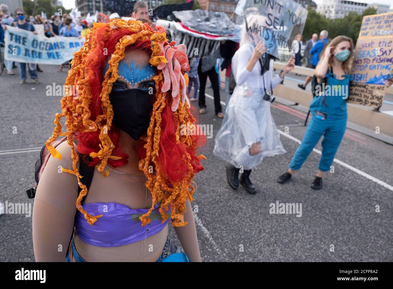 Extinction Rebellion activists at the Marine Rebellion march on 6th September 2020 in London, United Kingdom. Ocean Rebellion, Sea Life Extinction, Animal Rebellion and Extinction Rebellion joined together to celebrate the biodiversity found in our seas, and to grieve at the destruction of the Earth’s oceans and marine life due to climate breakdown and human interference, and the loss of lives, homes and livelihoods from rising sea levels. Extinction Rebellion is a climate change group started in 2018 and has gained a huge following of people committed to peaceful protests. These protests are Stock Photo