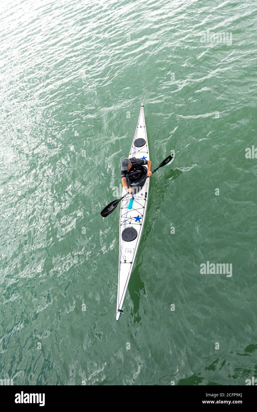 Overhead view of a male canoeist on the Thames Estuary off Southend on Sea, Essex, UK. Saltwater, offshore watersport. Leisure activity Stock Photo