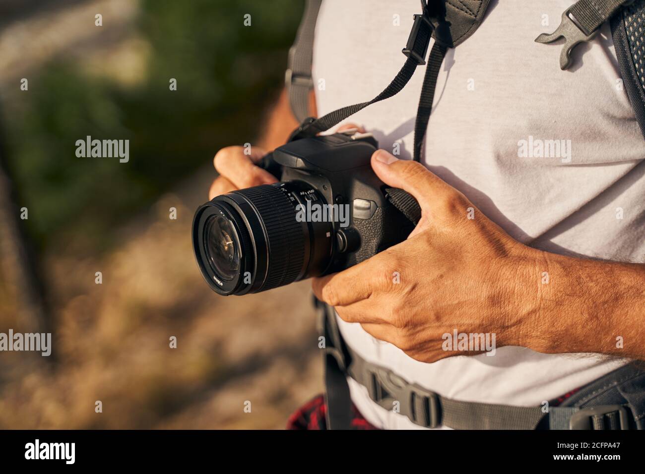 Man using digital camera in open air Stock Photo - Alamy
