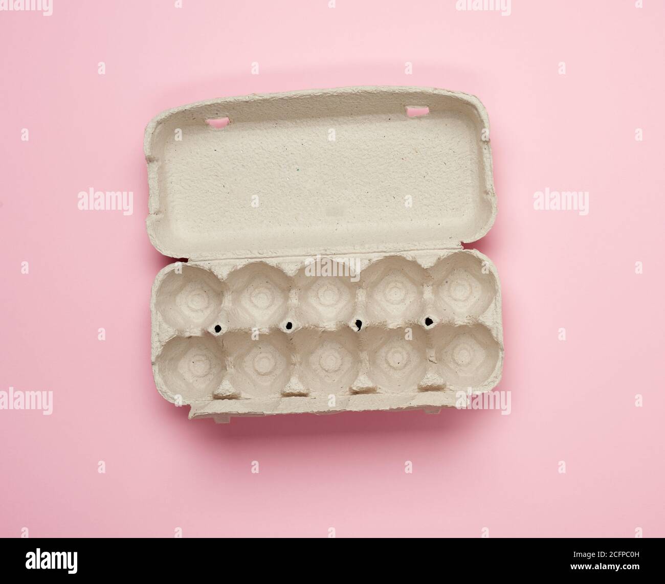 blank paper rectangular tray for chicken eggs on pink background, top view Stock Photo