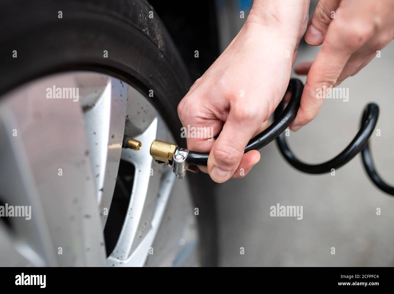 Filling air in tires on sale at gas station