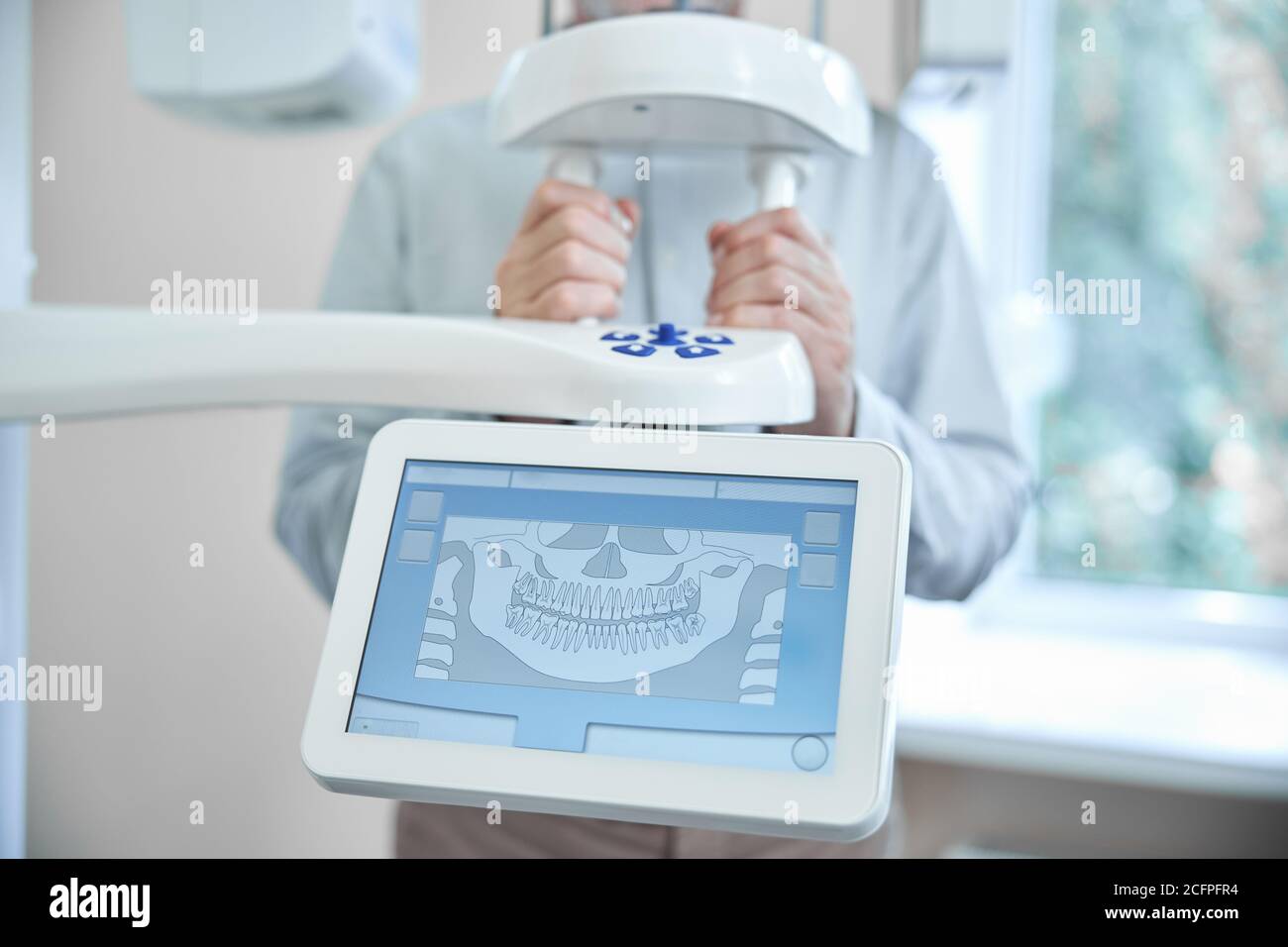 Patient of a dental clinic getting a panoramic dental xray Stock Photo