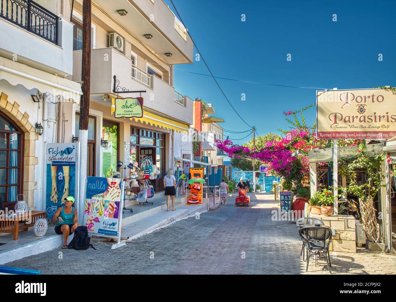 PANORMOS IN RETHYMNO, GREECE - AUGUST 7: (EDITORS NOTE: Image is a digital [High Dynamic Range, HDR] composite.) Streets and stores are nearly empty because of the economic crisis and pandemic on August 7, 2020 in Panormos in Rethymno, Greece. Stock Photo