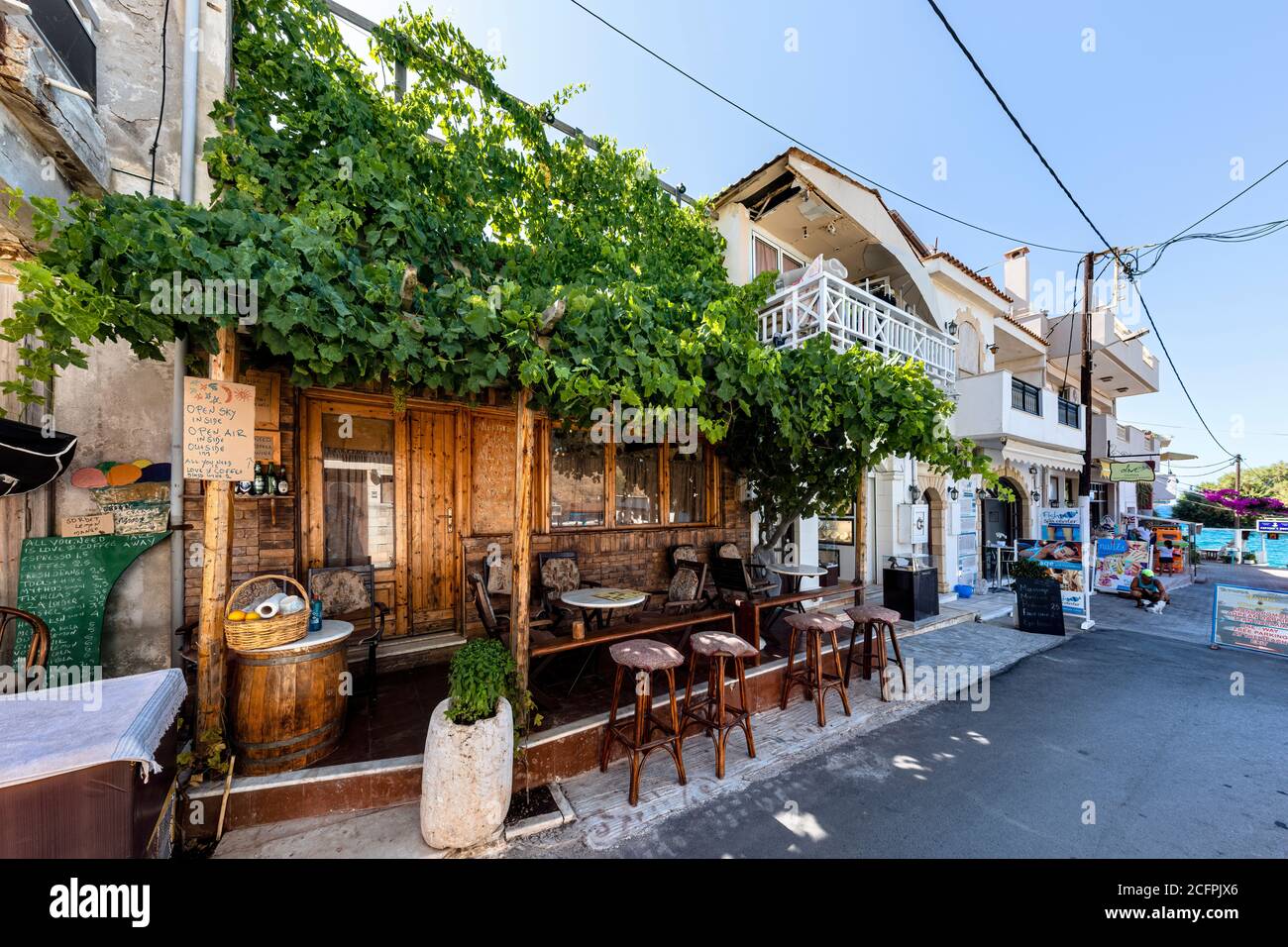 PANORMOS IN RETHYMNO, GREECE - AUGUST 7: (EDITORS NOTE: Image has been digitally enhanced.) Streets and stores are nearly empty because of the economic crisis and pandemic on August 7, 2020 in Panormos in Rethymno, Greece. Stock Photo