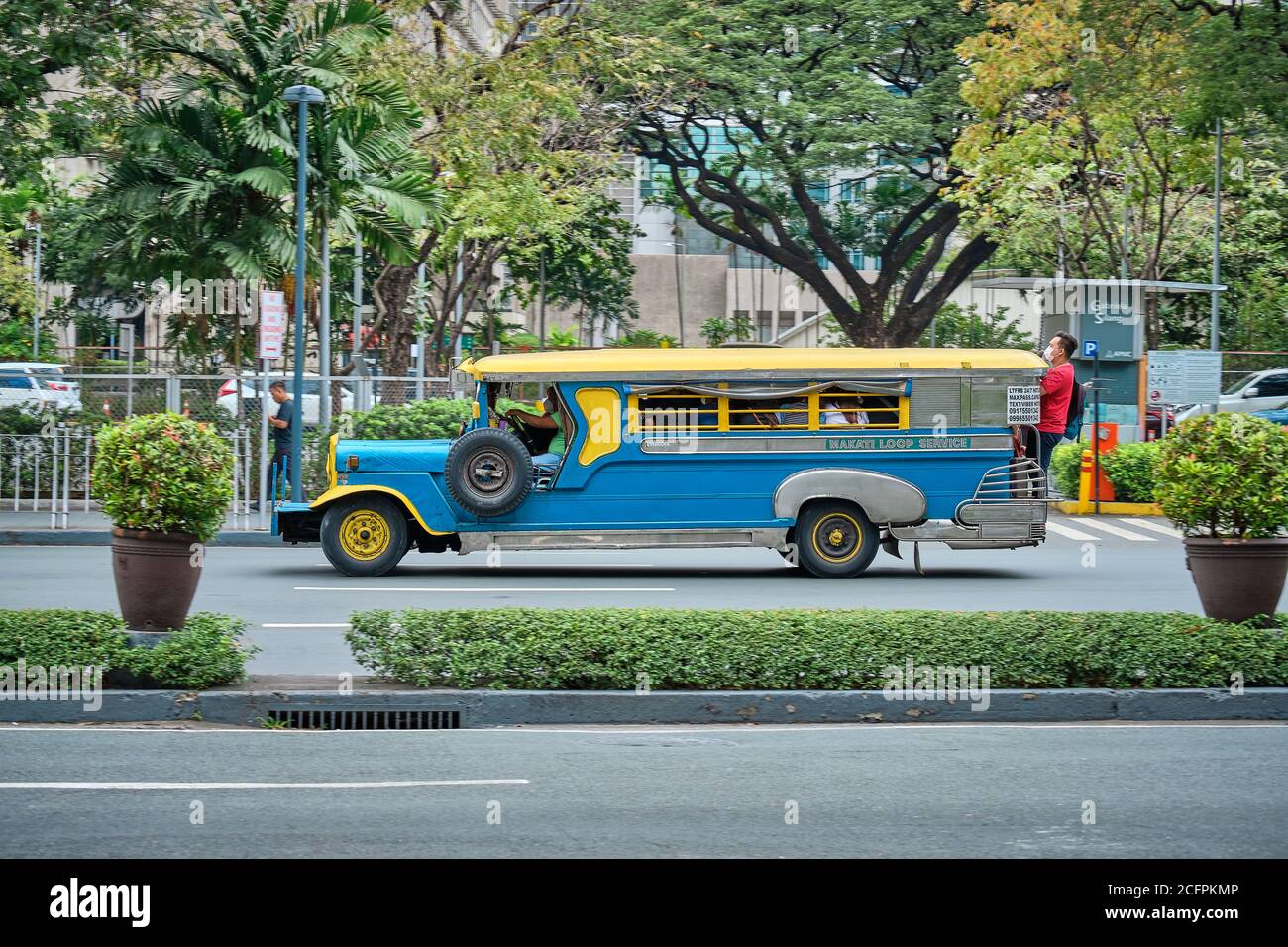 Manila, Philippines - Feb 02, 2020: Jeepneys on the roads of Manila. Former American military jeeps converted to public transport. Stock Photo