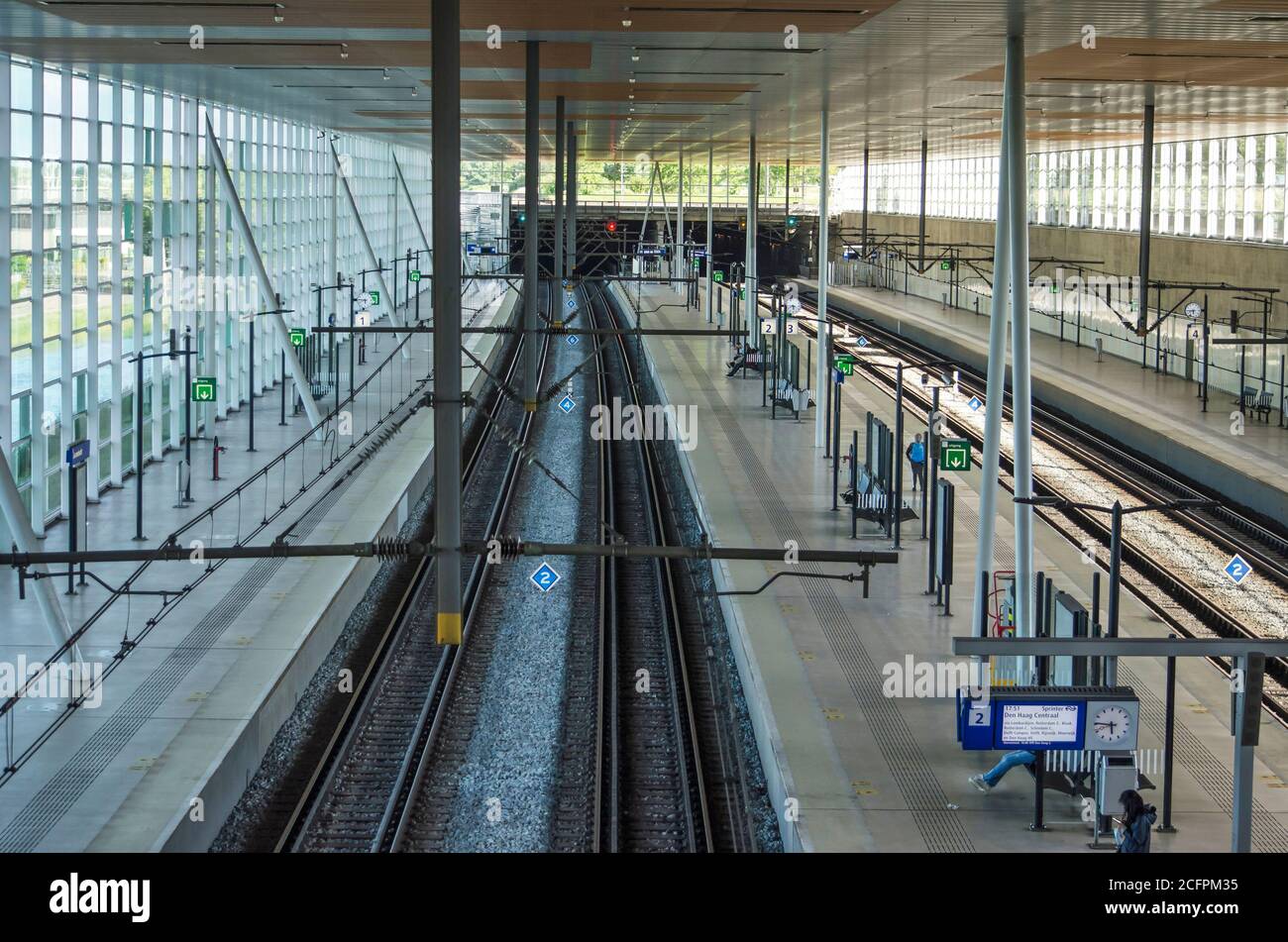 Barendrecht, The Netherlands, July 10, 2020: interior of the railway station with four tracks and glass facades Stock Photo