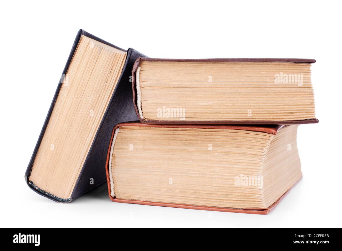 Three closed old thick paper books with yellow pages white background
