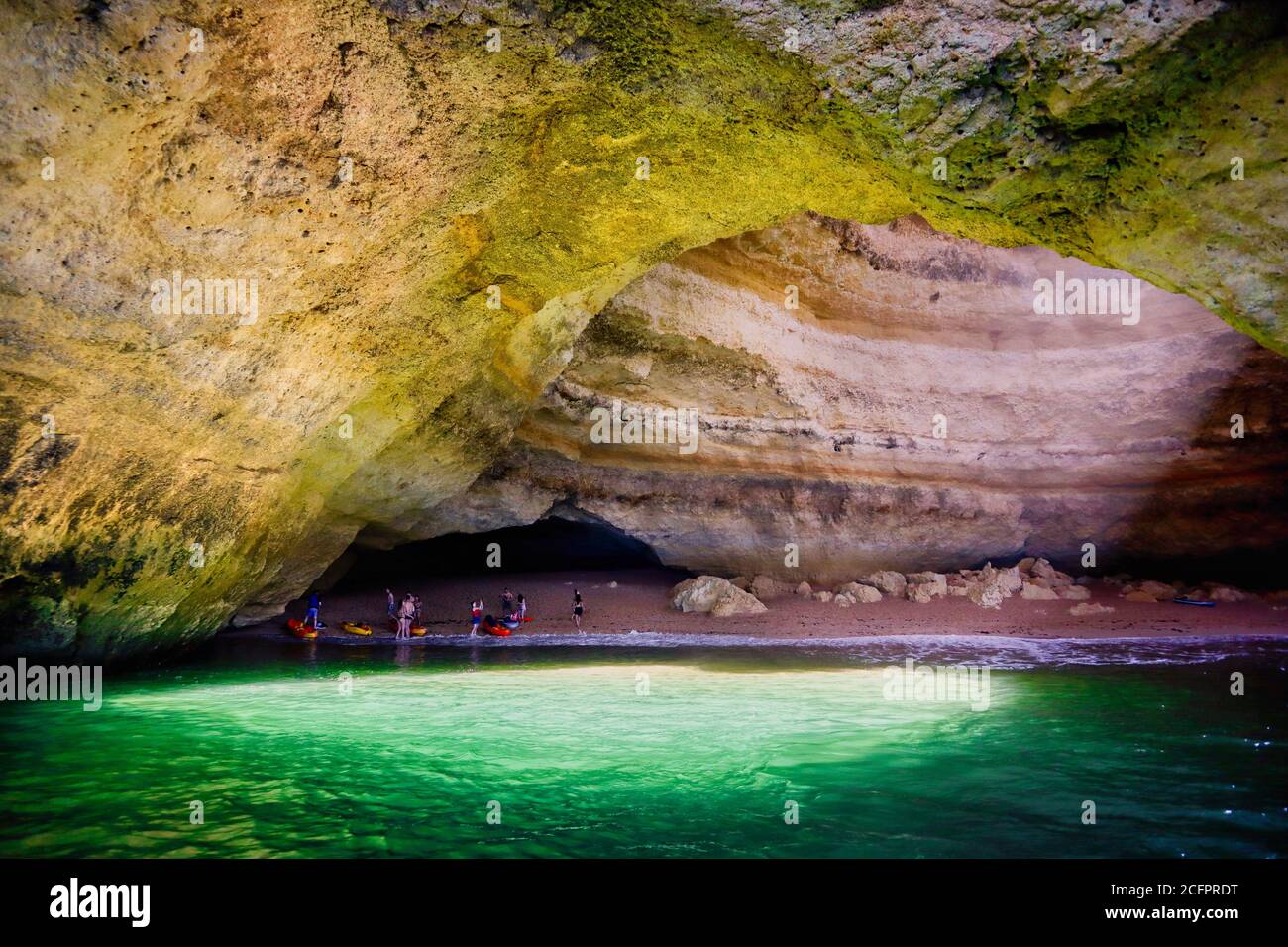 A picture of Benagil cave taken from a boat with a view of light coming from the hole up in the cave Stock Photo