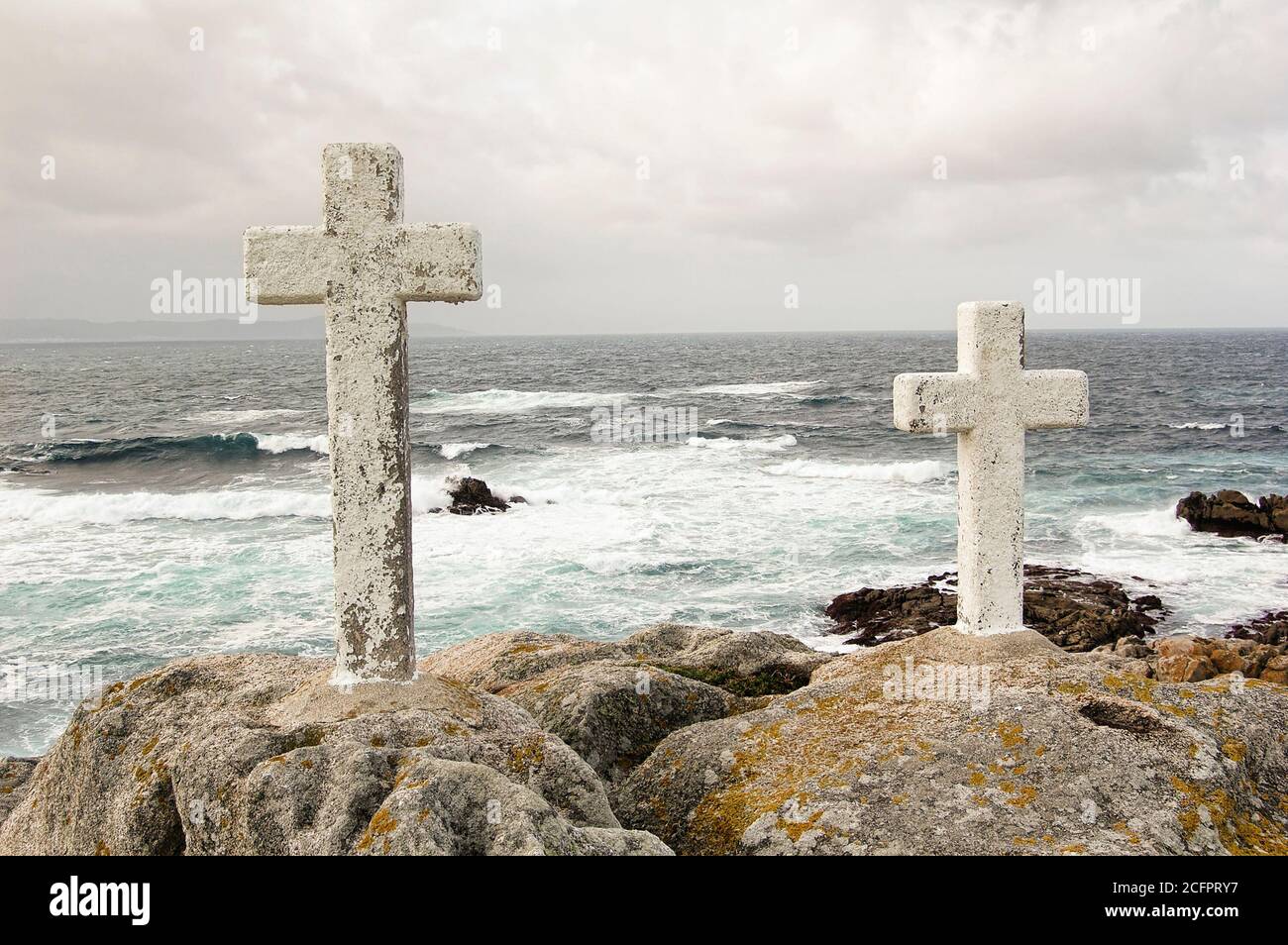 Two stone crosses in the coastal region of Galicia (Spain) called Costa de la Muerte. It is located  between Cape Finisterre and Malpica de Bergantiño Stock Photo