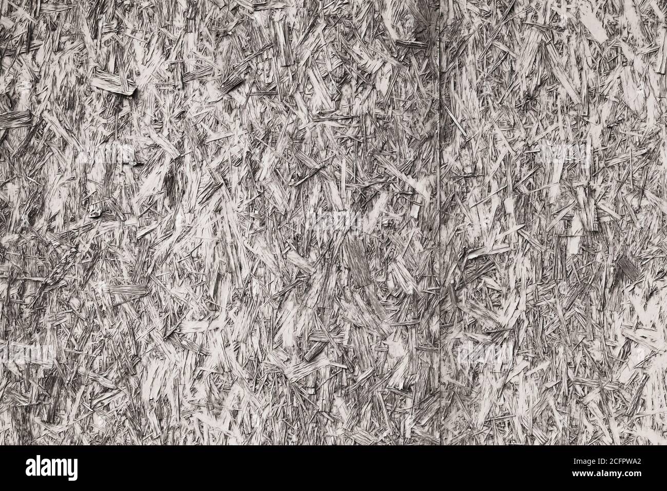 Old oriented strand board or OSB. Frontal view, front view. Background