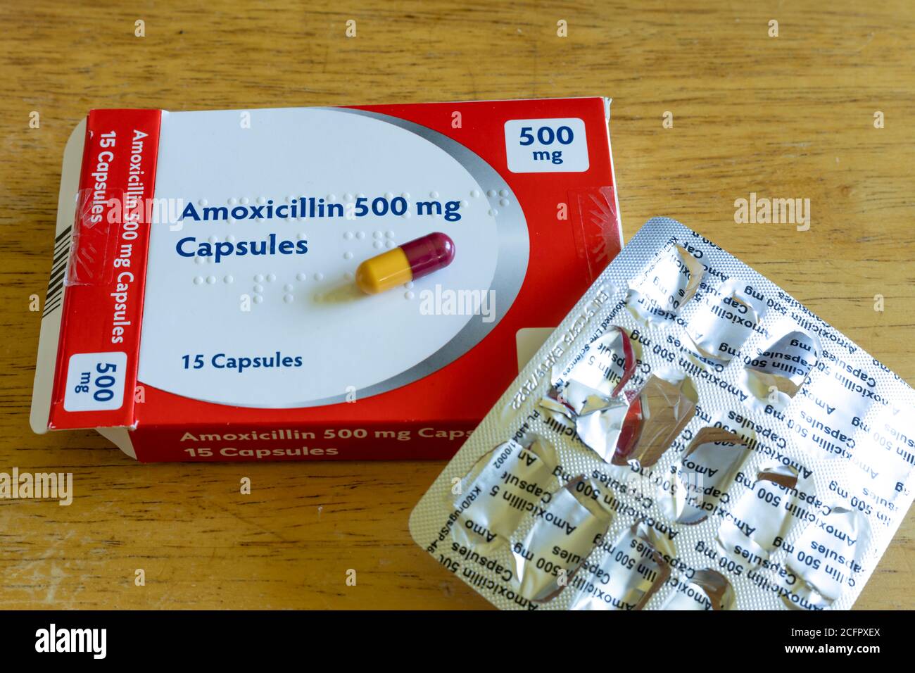 Opened packet of Amoxicillin capsules, a common antibiotic medication used for treating infections Stock Photo