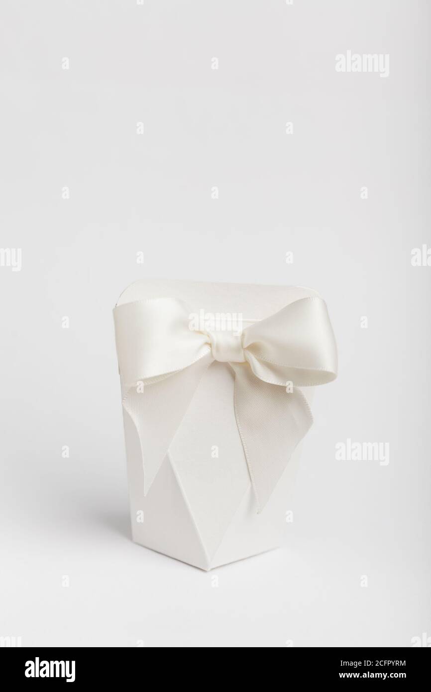 White Diamond Box Original diamond shaped box with ribbon on white Stock Photo - Alamy