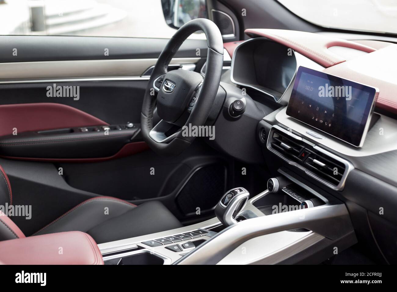Russia, Izhevsk - August 14, 2020: Geely showroom. Interior of new modern CoolRay with black and red leather trim. Car manufacturer from China. Stock Photo