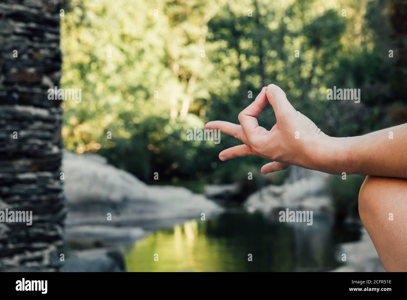 woman's hand doing a mudra in nature Stock Photo