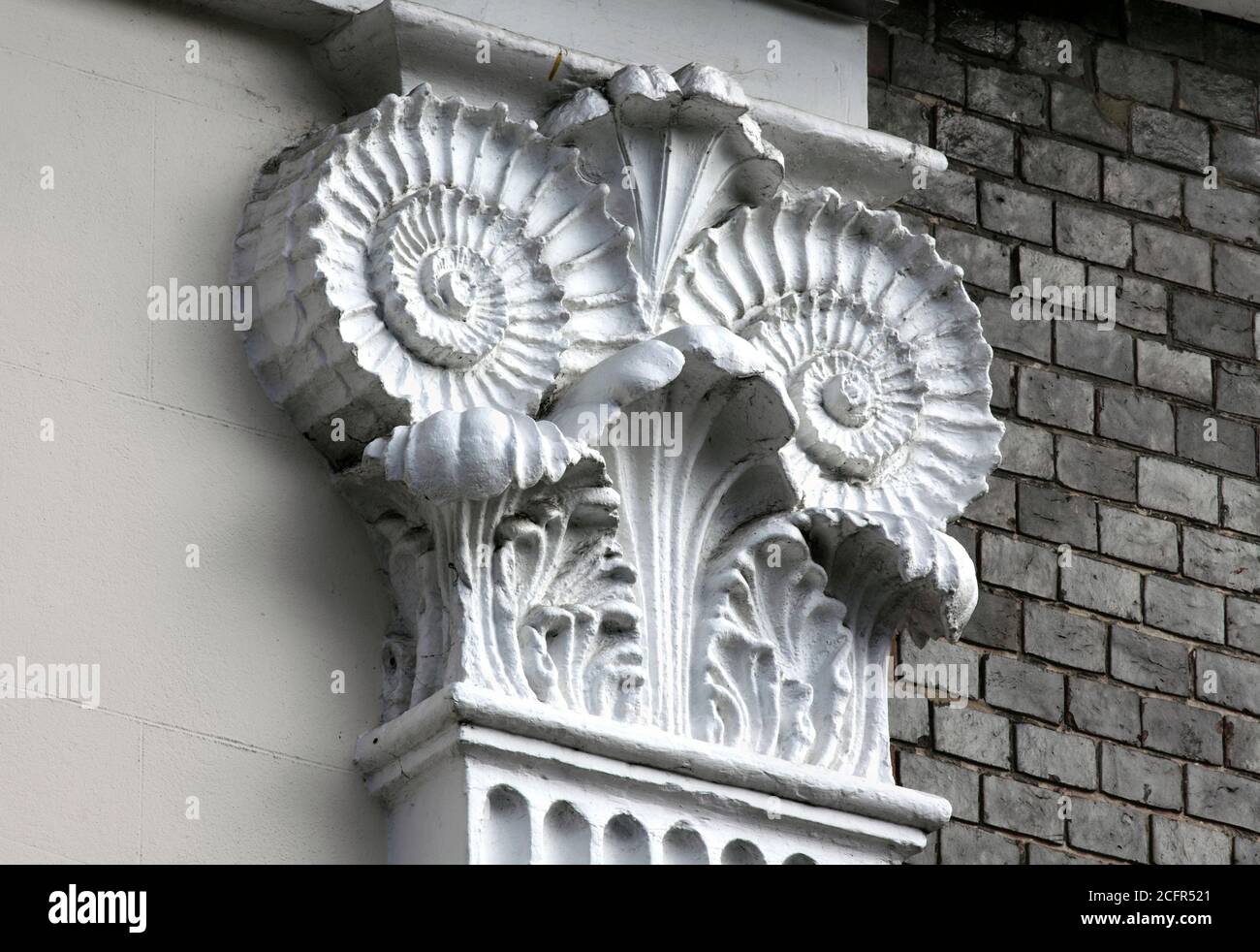 Close up of ammonite capitals on a building (Castle Place), designed by architect Amon Wilds, on Lewes High Street, East Sussex. Stock Photo