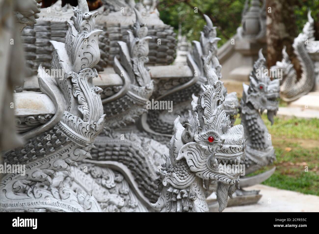 Mystic dragon statues in front of a temple in Thailand Stock Photo