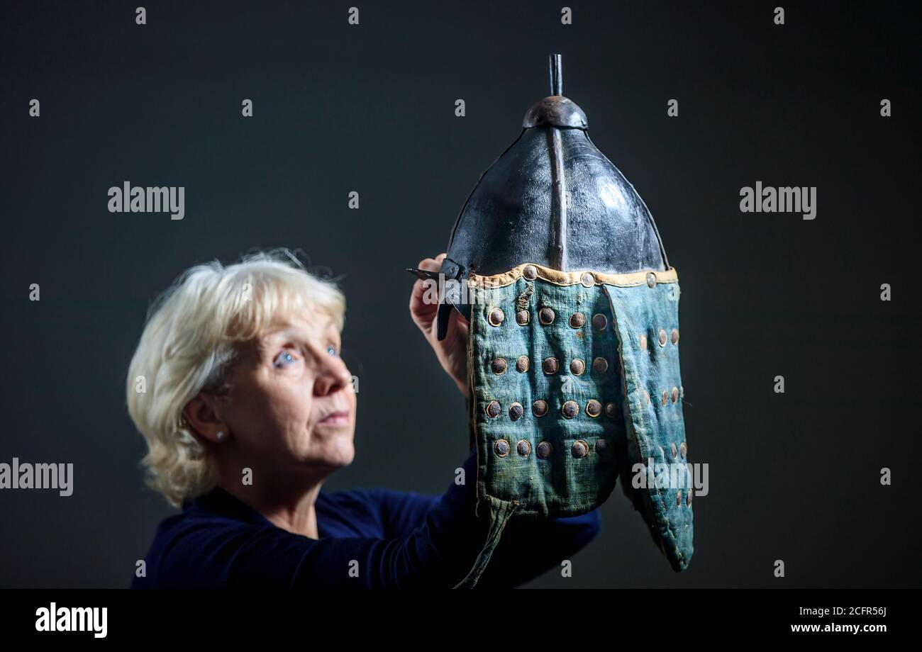 Militaria Specialist Oonagh Drage holds a Korean 'War' Helmet on display at Tennants Auctioneers in Leyburn, North Yorkshire, following its sale for GBP 4,800 at an Militaria and Ethnographica auction last week. Stock Photo