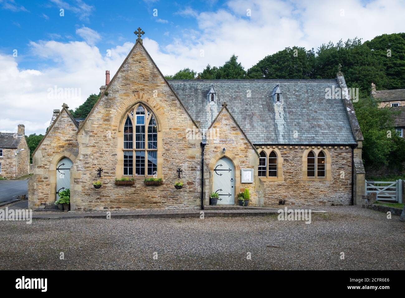 The White Monk tearoom, an old Victorian Grade II listed schoolhouse converted to a café in the village of Blanchland, Northumberland Stock Photo