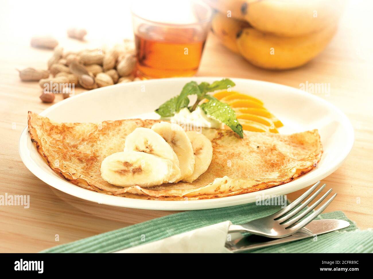 Crepe pancake with banana and peanut butter Stock Photo Alamy