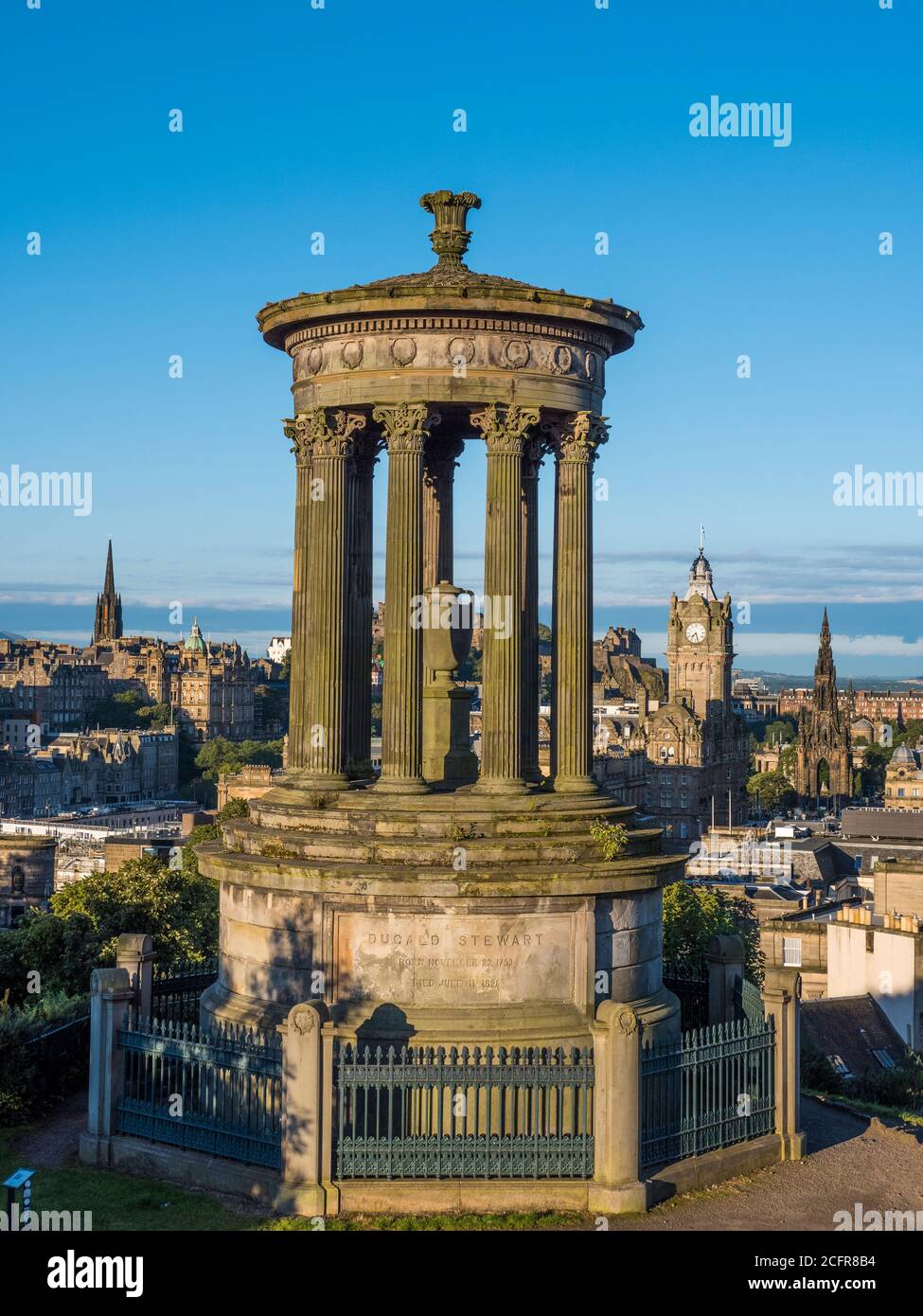 Edinburgh Landscape with, Dugald Stewart Monument, The City of Edinburgh in the Background with the Balmoral Hotel, Scotland, UK. Stock Photo