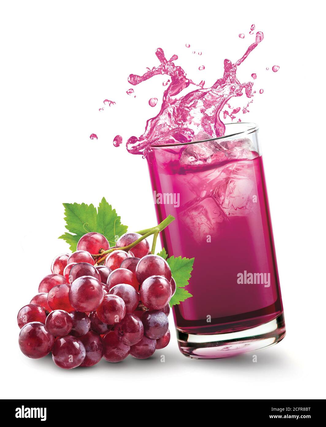Glass of splashing grape juice with grape fruit on white background Stock Photo