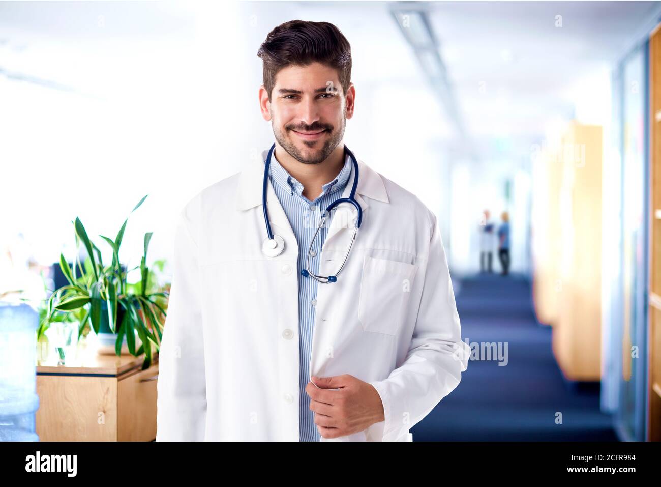Confident male doctor standing hi-res stock photography and images - Alamy
