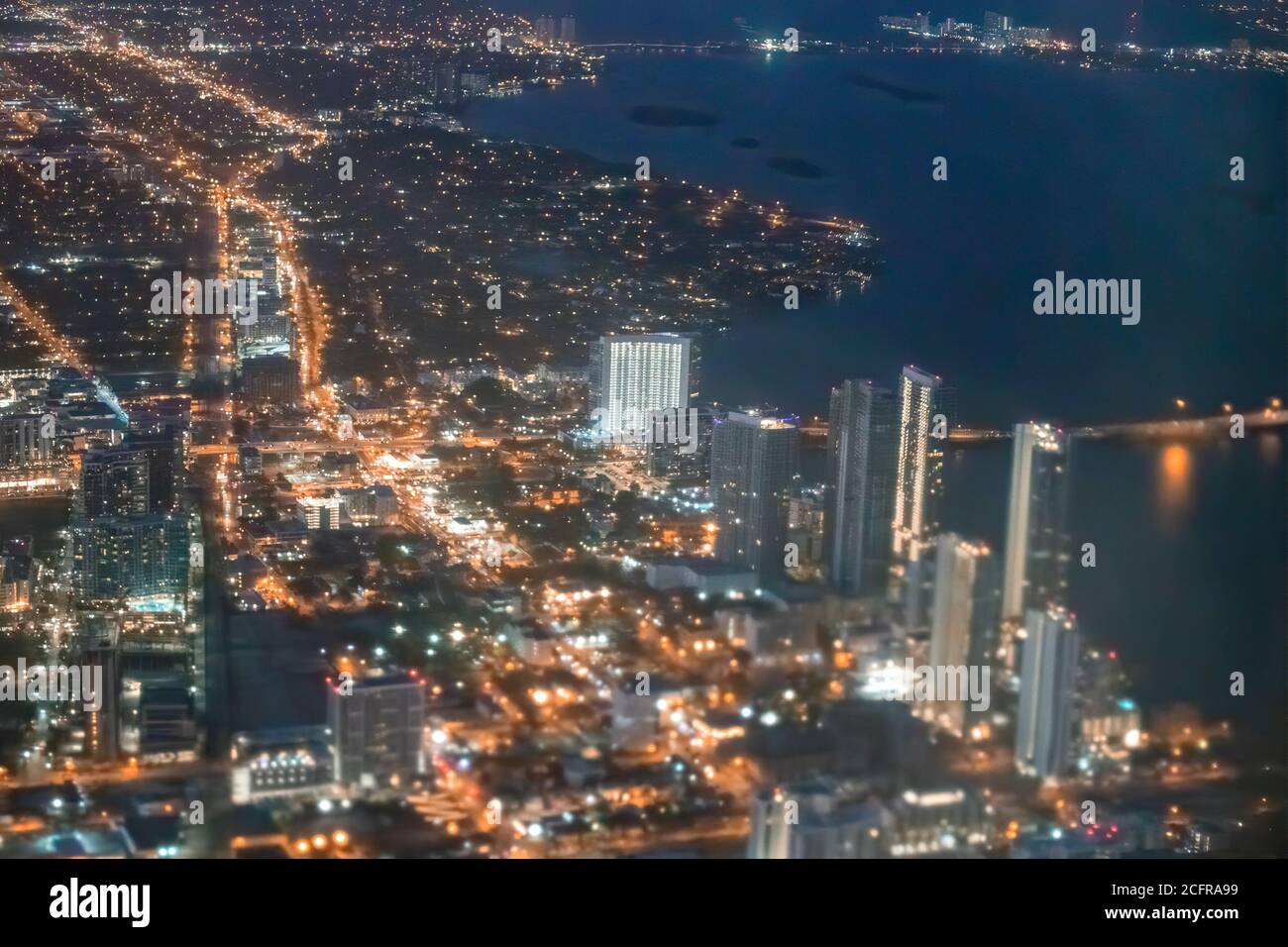 Night Aerial View Of Miami Beach Skyline From The Airplane Stock Photo