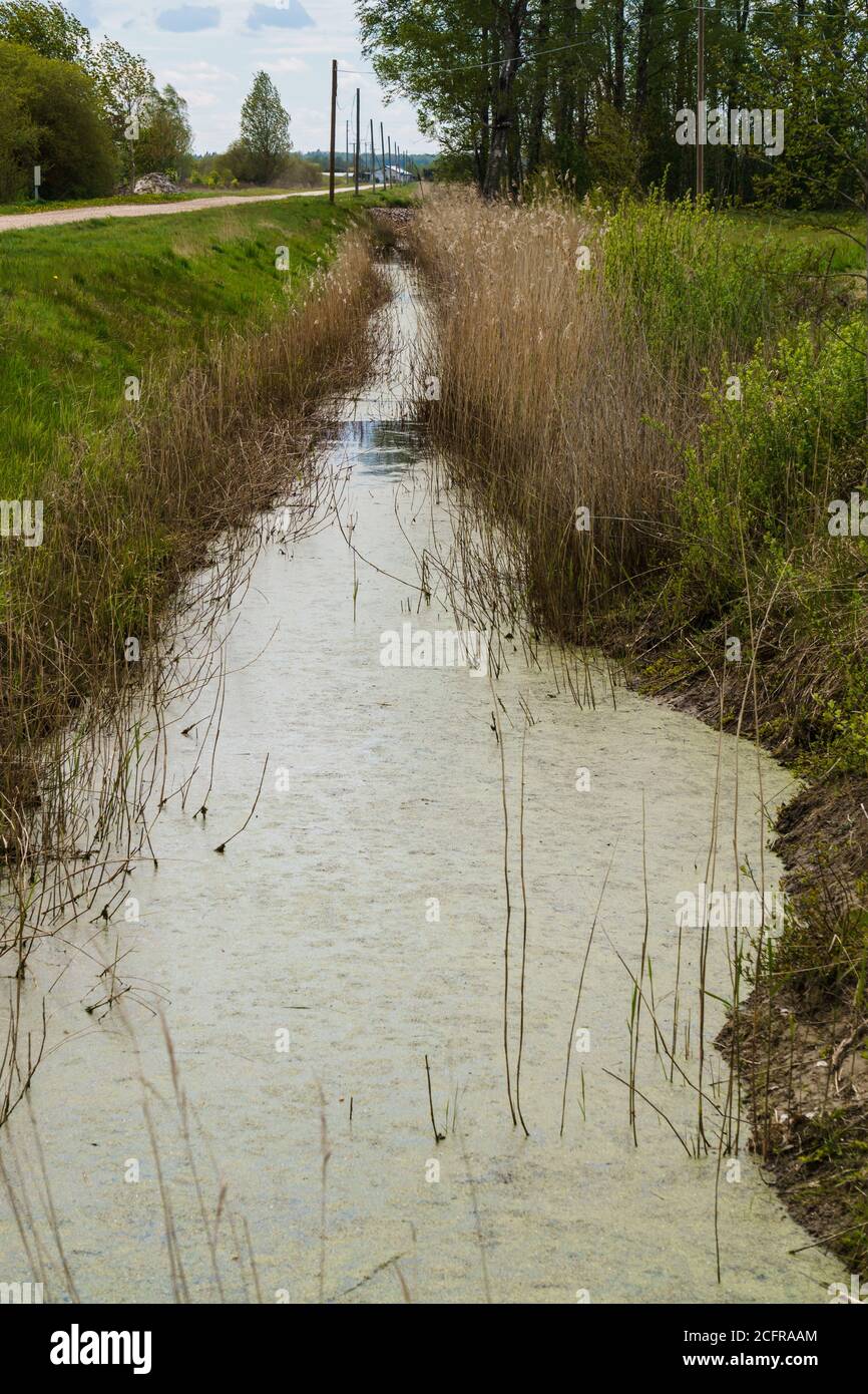 A small water channel leading to the dam Stock Photo Alamy
