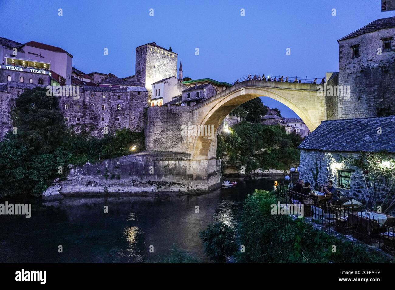 Bosnia-Herzegovina: Mostar. The old townat dusk and its famous bridge over the Neretva River, district registered as a UNESCO World Heritage Site. Tou Stock Photo