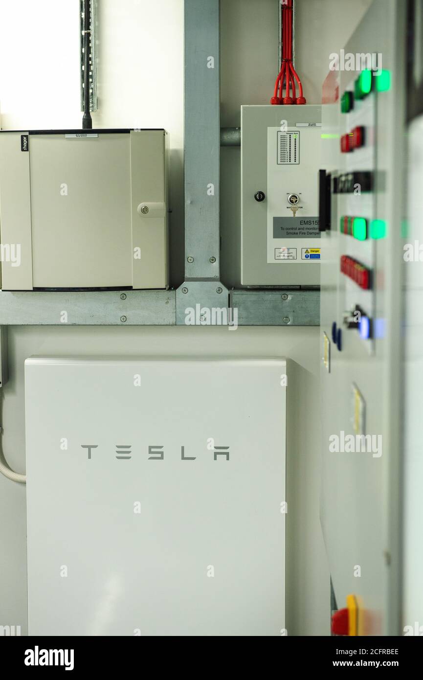 TESLA batteries in a green energy hub boiler room Stock Photo - Alamy