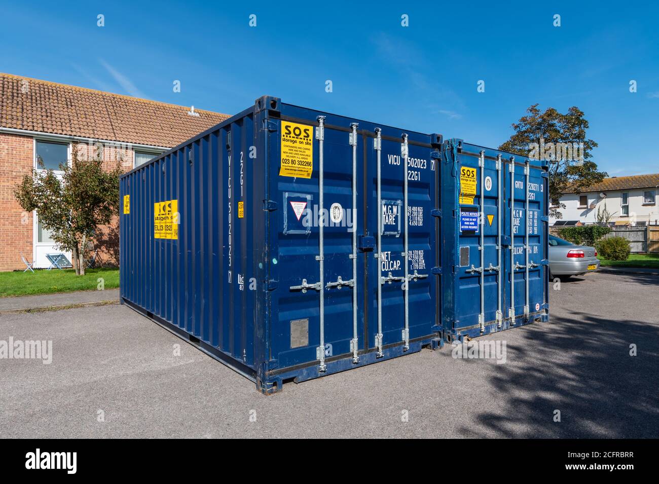 Pair of large metallic VICU storage containers, used for on-site storage. Stock Photo