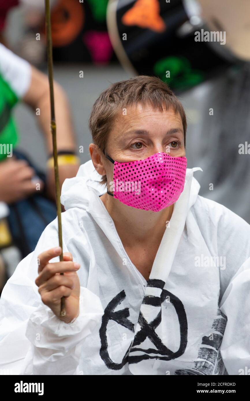 Portrait of protester in face mask, Extinction Rebellion demonstration outside the Department for Transport, London, 3 September 2020 Stock Photo