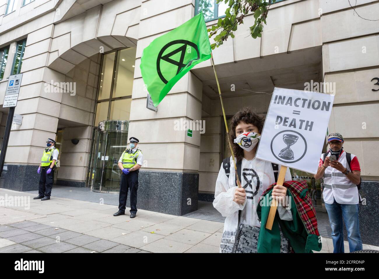 Protester holding placard, Extinction Rebellion demonstration outside the Department for Transport, London, 3 September 2020 Stock Photo